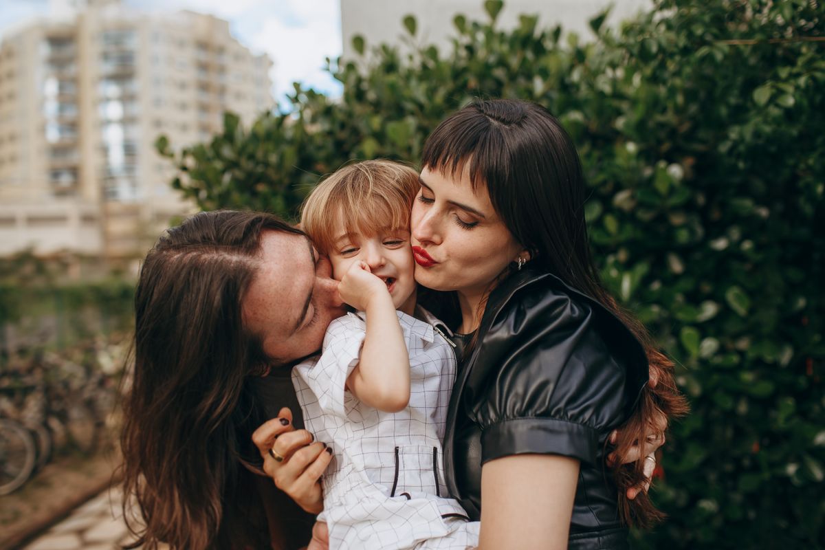 Happy Family Outdoors with Mother and Child