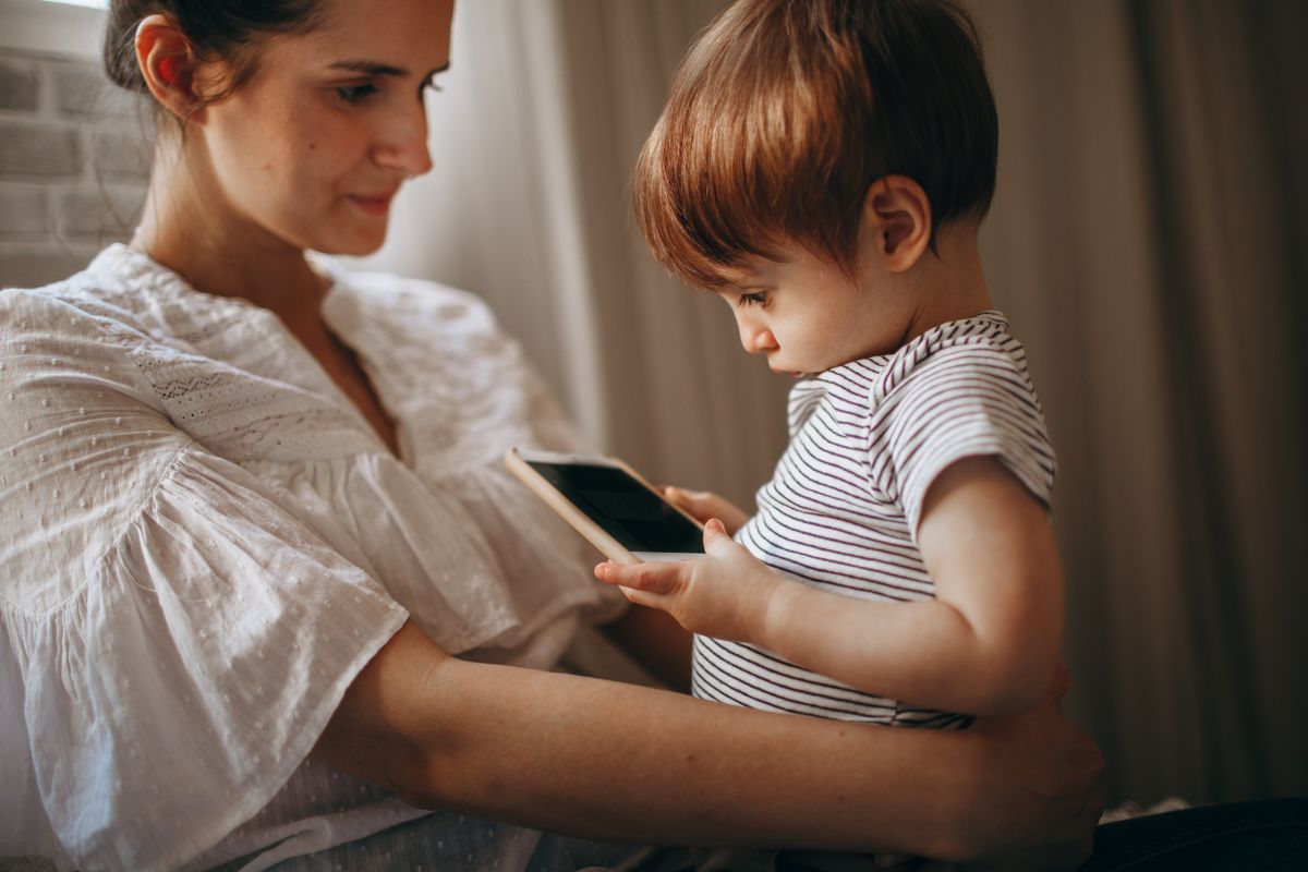 Mother and Child Interacting with Smartphone at Home