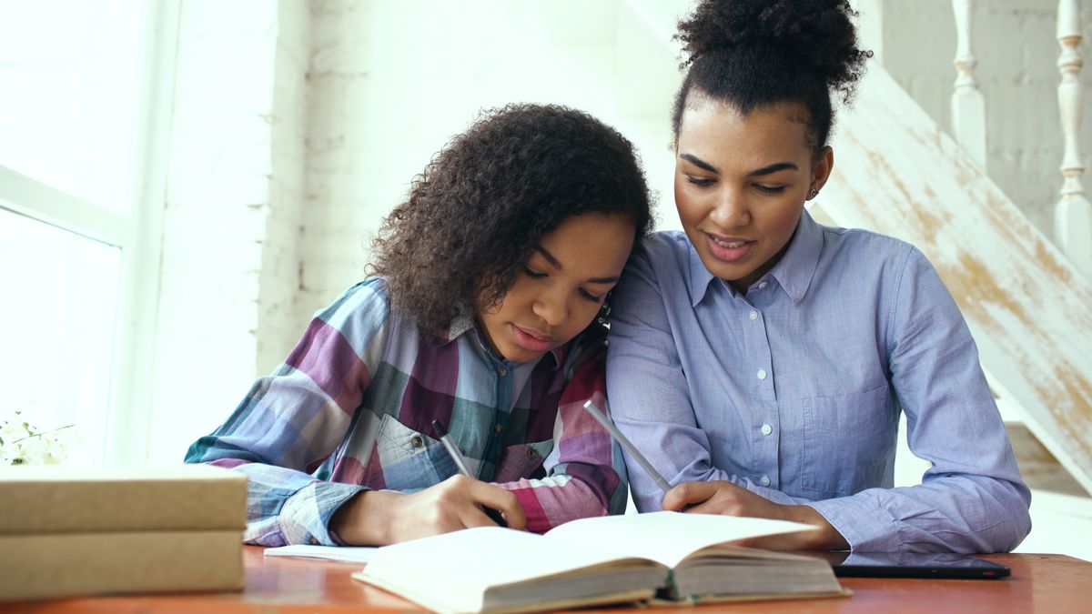 Mother and Daughter Studying Together at Home